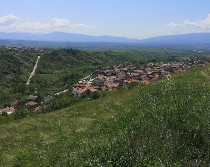 a view of a small village on a hill