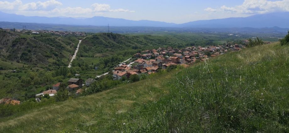 a view of a small village on a hill